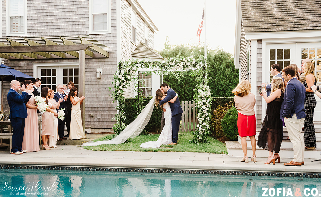 Poolside chuppah for Nantucket backyard micro wedding. Photo by Zofia & Co Photography