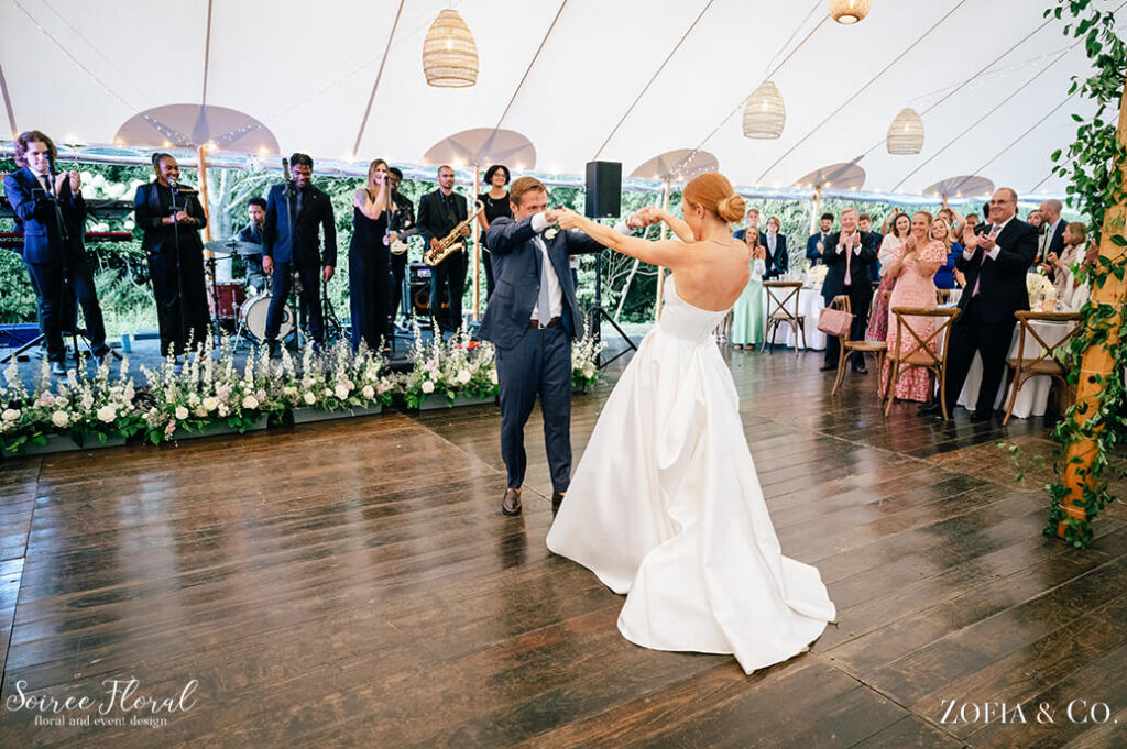 the bride and groom dancing