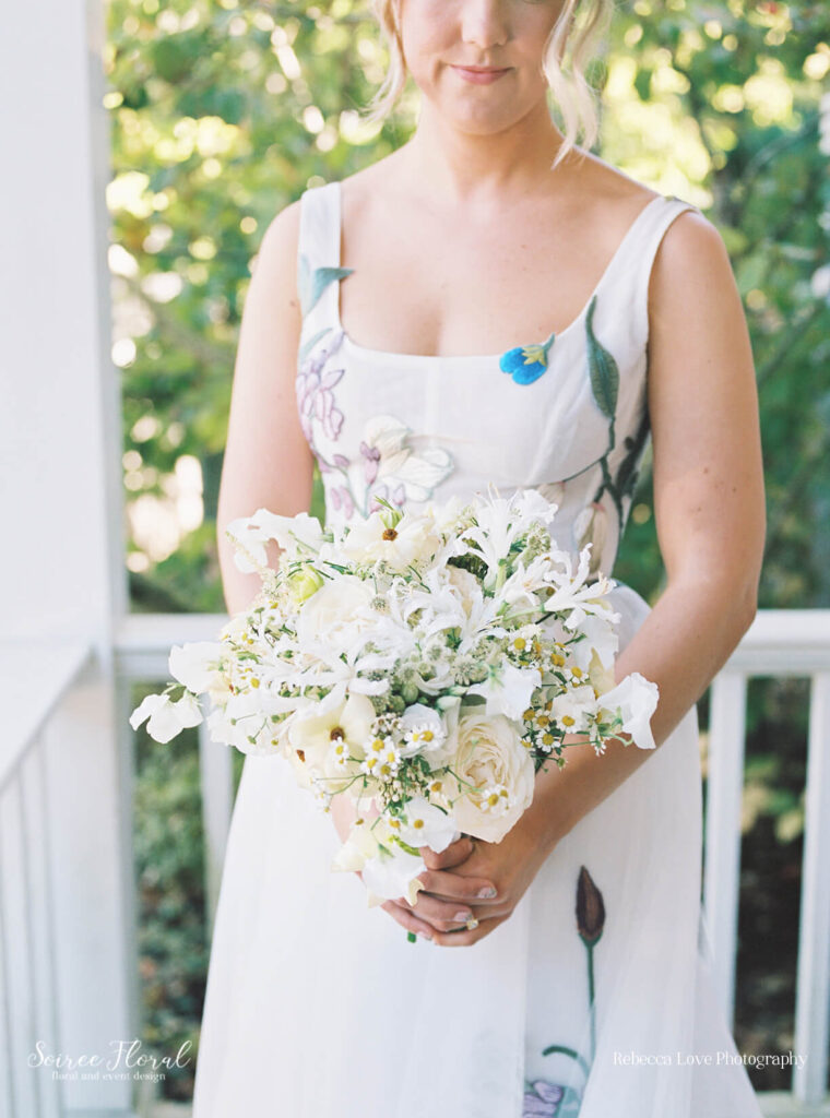 White wedding bouquet with garden roses and chamomile