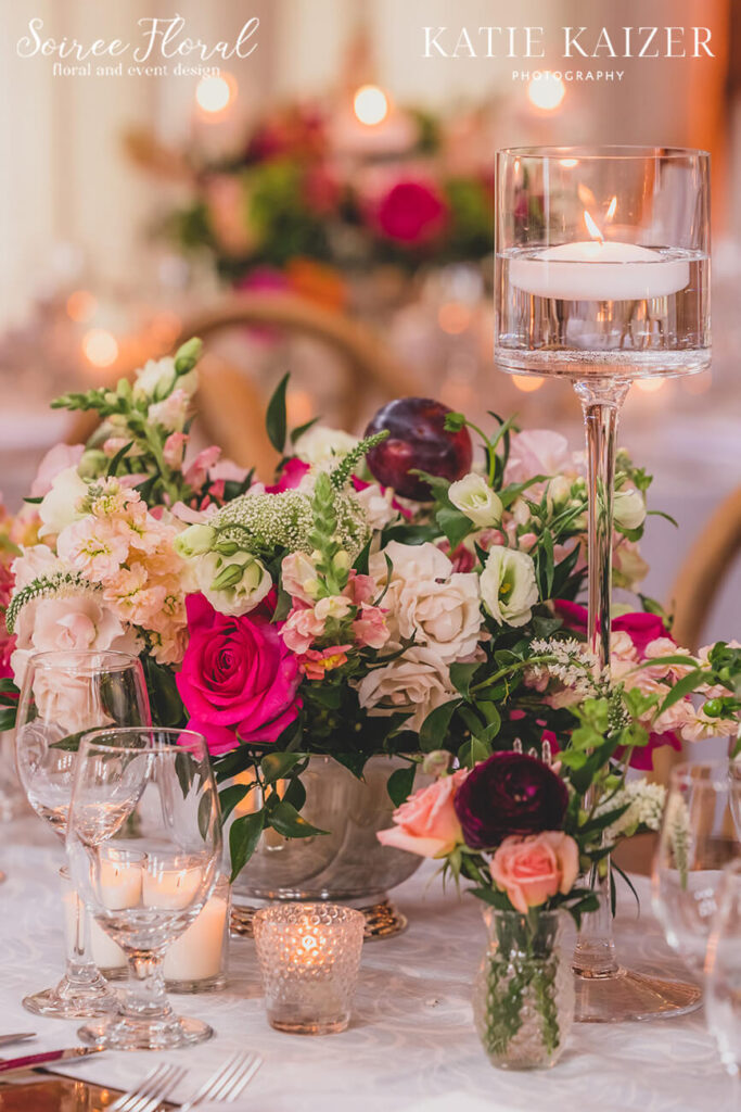 rose centerpieces with currants, plums, and apricots