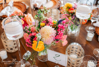 wedding table with sunset colored flowers
