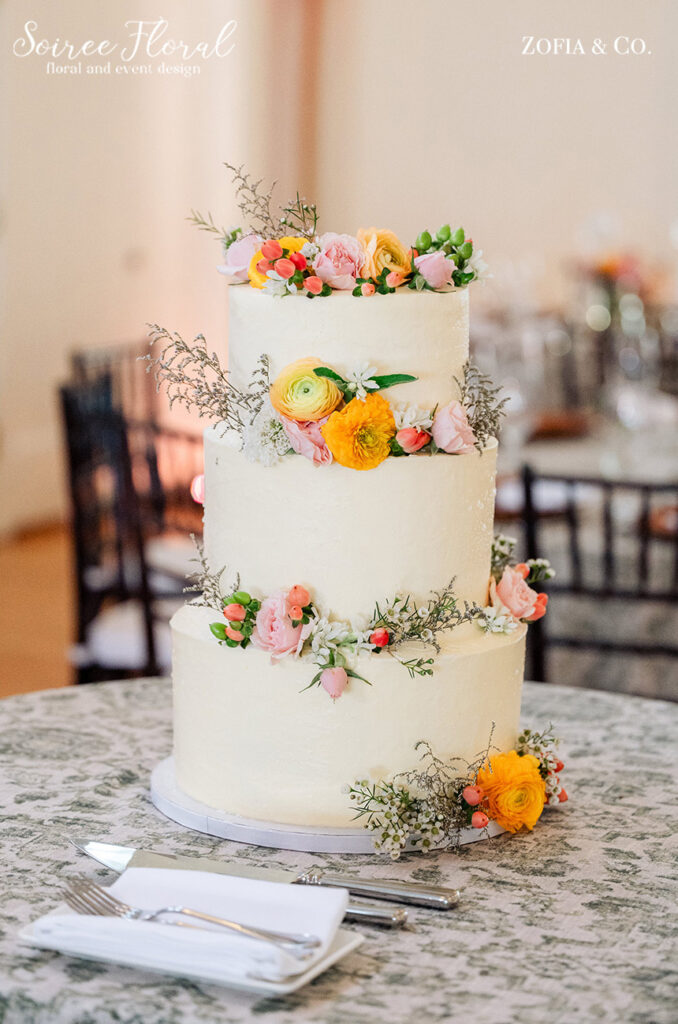 three-tier wedding cake with flowers
